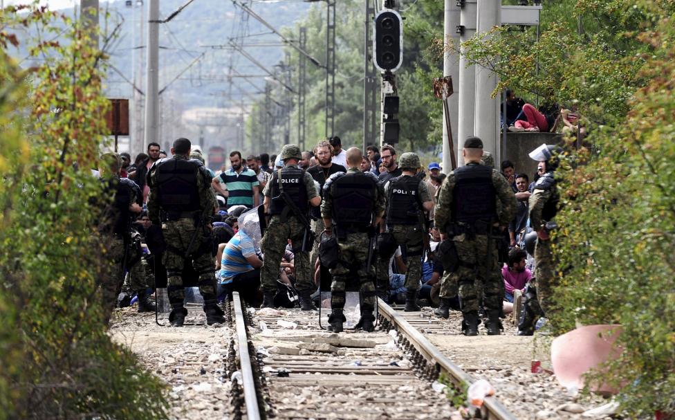 Macedonian special policemen guard the border as more than a thousand immigrants wait at the border line of Macedonia and Greece to enter Macedonia near the Gevgelija railway station